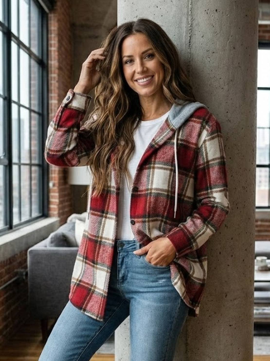 Woman wearing cozy Highland Plaid Shacket with hood and button front, styled for cool weather layering