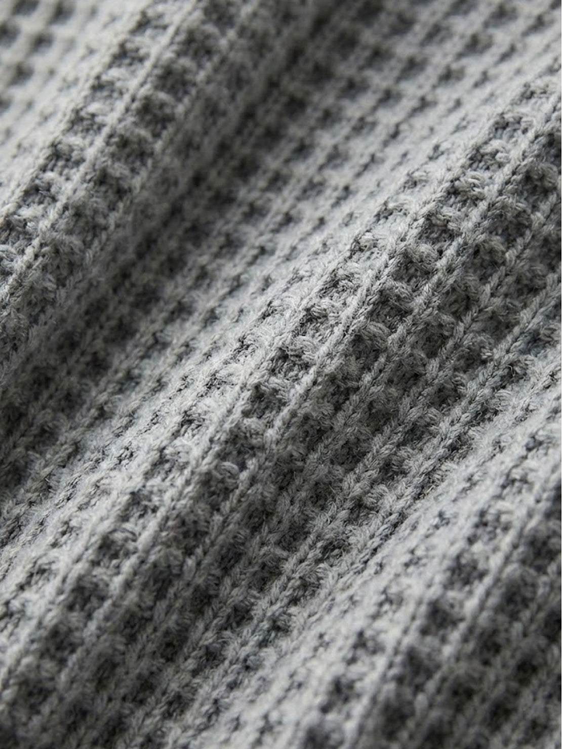 Woman wearing a pink two-piece oversized set for multi-weather comfort with relaxed fit and mid-weight fabric