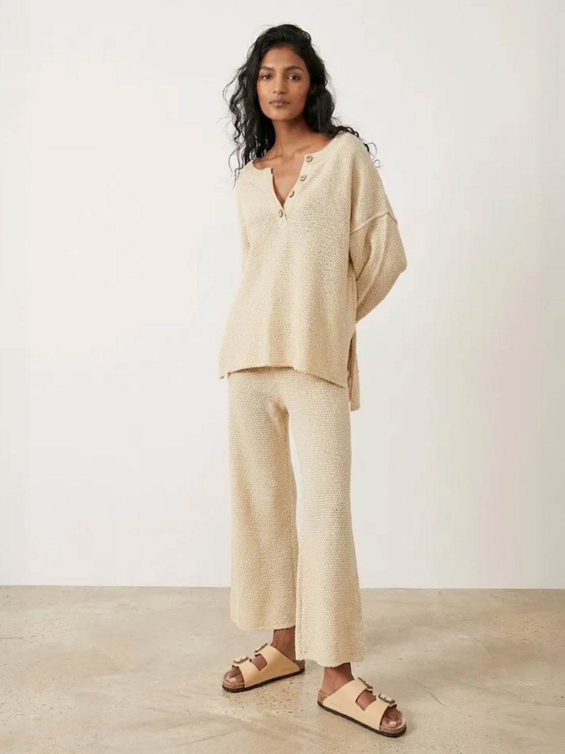 Woman wearing oversized two-piece set for multi-weather comfort with relaxed fit and mid-weight fabric