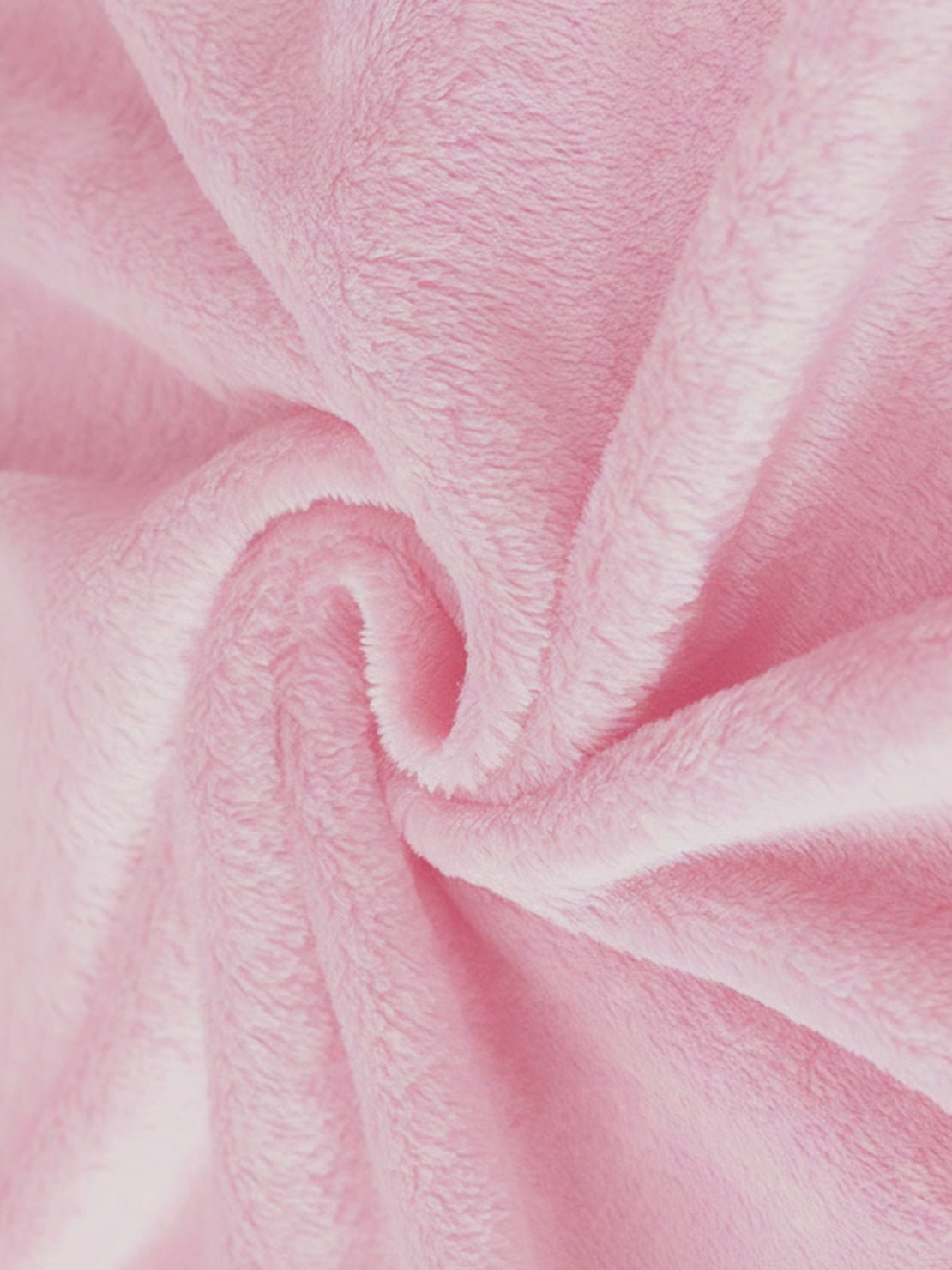 Close-up of soft pink plush faux fur fabric for open front oversized fur jacket texture