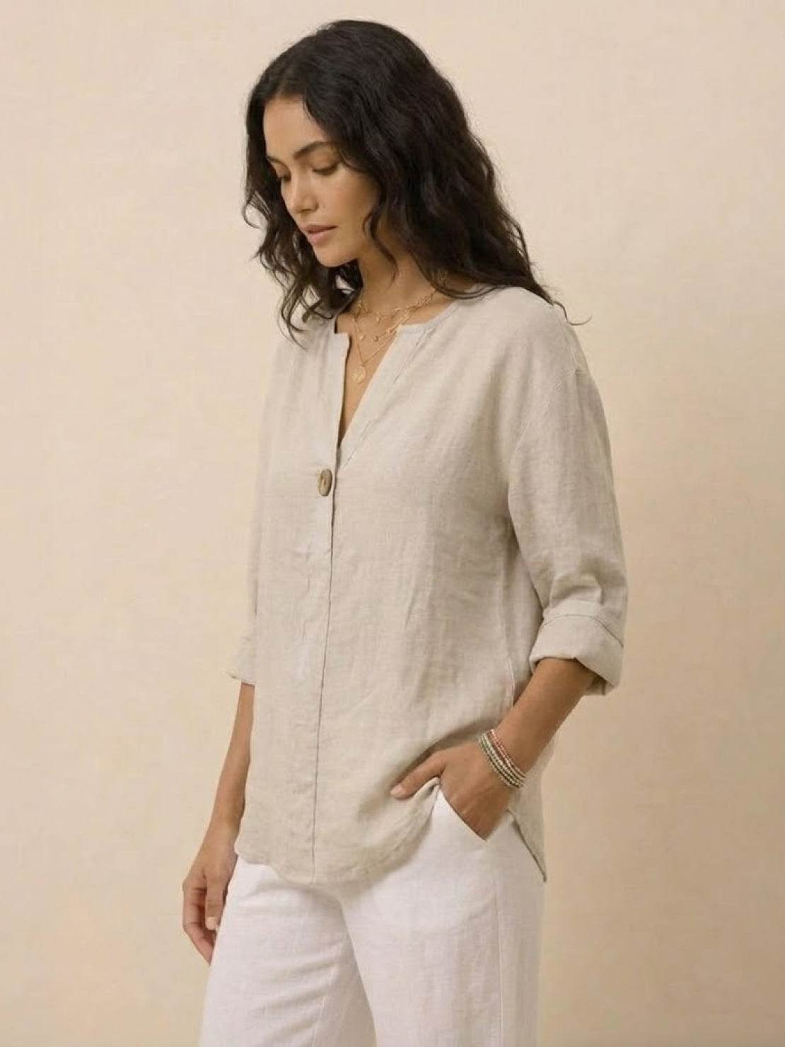 White pure linen age-defying shirt with elegant button detail on hanger