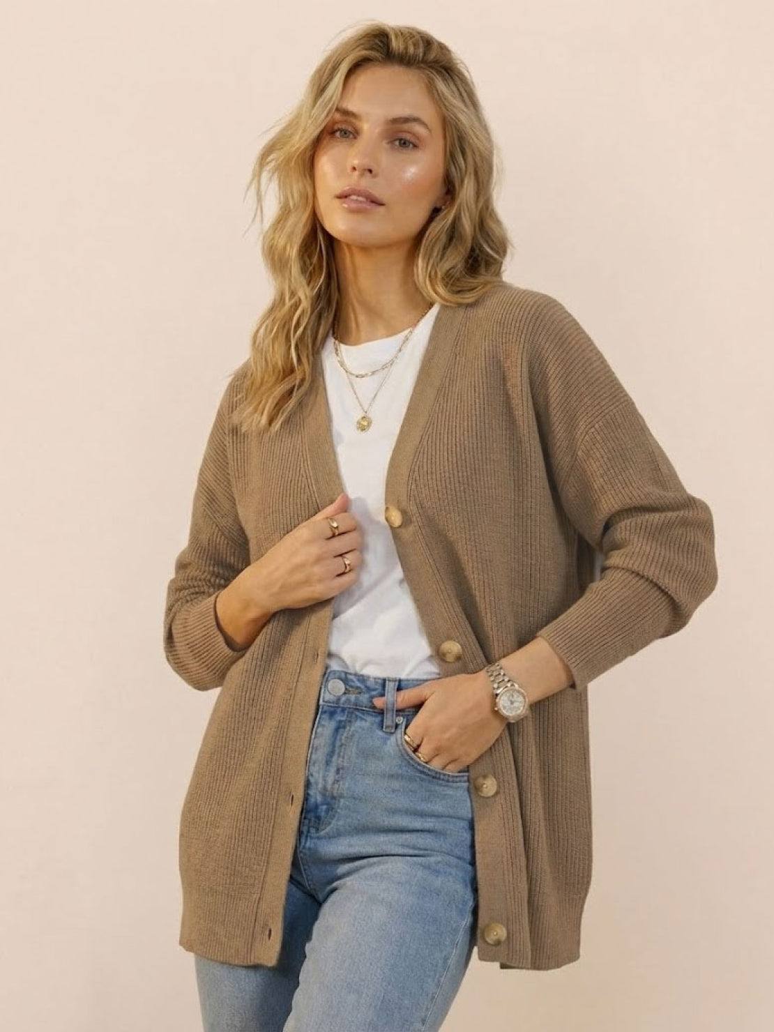 Relaxed fit oversized button down knitwear cardigan in beige worn with white top and blue jeans