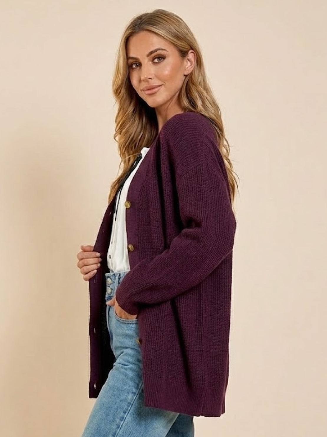 Relaxed fit oversized button down knitwear cardigan in deep purple worn with casual jeans and white top