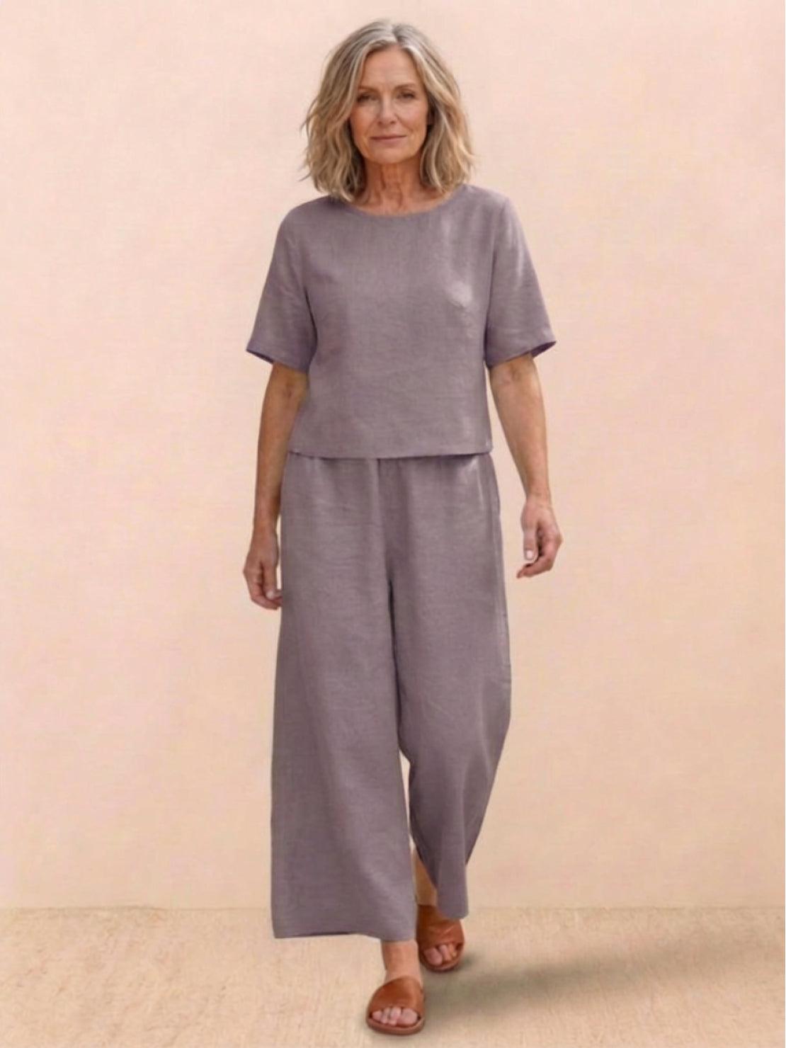 woman wearing loose fit co-ord set with soft-tailored top and wide-leg bottoms