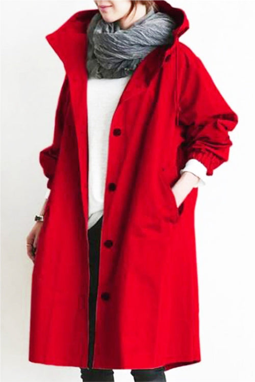 Red oversized Rain Couture Windbreaker jacket with hood and button closure on model