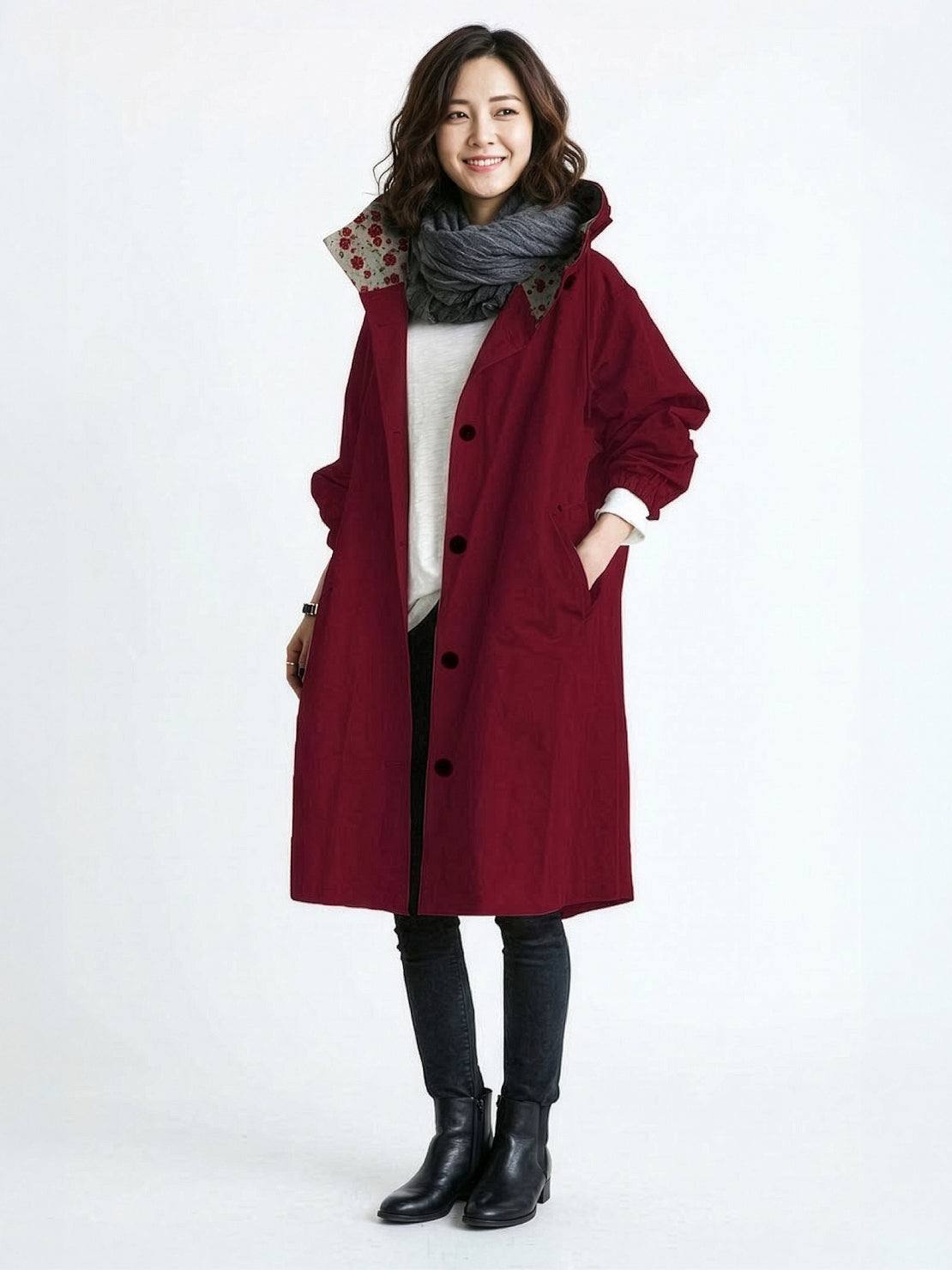 Water-resistant oversized hooded windbreaker rain jacket in stylish outdoor setting