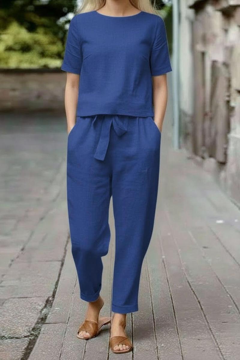 Blue cotton linen set with relaxed short-sleeve top and straight-leg pants styled with sandals