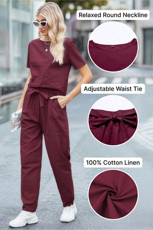 Woman wearing maroon relaxed fit cotton linen set with round neckline and adjustable waist tie, styled with white sneakers and sunglasses