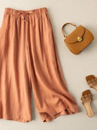 100% Cotton Linen Tuscany Rise 2 Piece Set with sheer embroidered top and wide-leg linen trousers