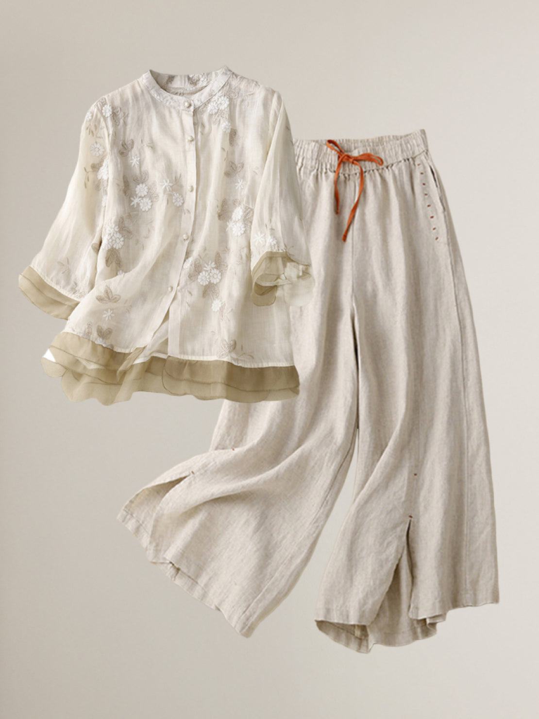 Lightweight 100% cotton linen Tuscany two-piece outfit with embroidered sheer top and wide-leg trousers.