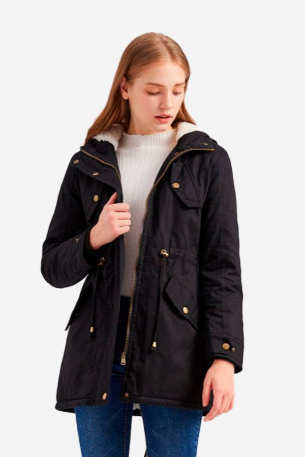 Woman wearing black extra comfortable cotton parka coat with fluffy hood and metal zipper