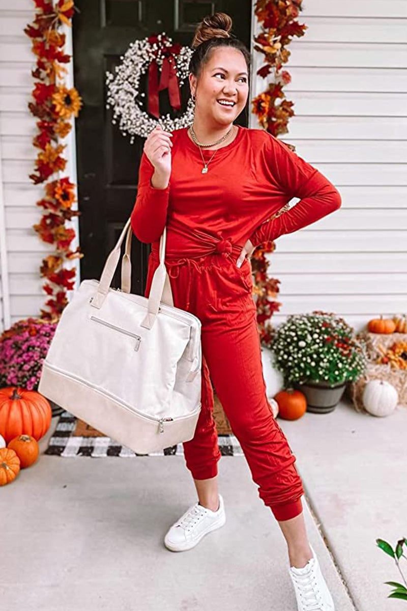 woman wearing cozy chic two-piece sweatsuit set with long-sleeve top and high-waisted pants with pockets