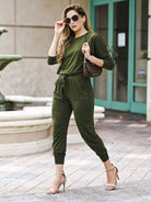woman wearing Cozy Chic Two-Piece Sweatsuit set with long-sleeve top and high-waisted pants with pockets