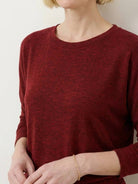 Woman wearing Cozy Chic Two-Piece Sweatsuit Set with long-sleeve top and high-waisted pants with pockets