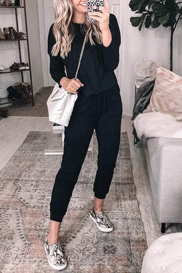 woman wearing Cozy Chic Two-Piece Sweatsuit Set with long-sleeve top and high-waisted pants with pockets