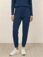 woman wearing Cozy Chic two-piece sweatsuit set with long-sleeve top and high-waisted pants with pockets