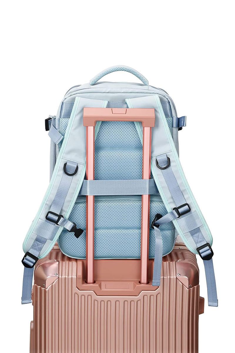 Chic Wanderlust Waterproof Backpack in light blue attached to rose gold suitcase handle showing padded ergonomic straps