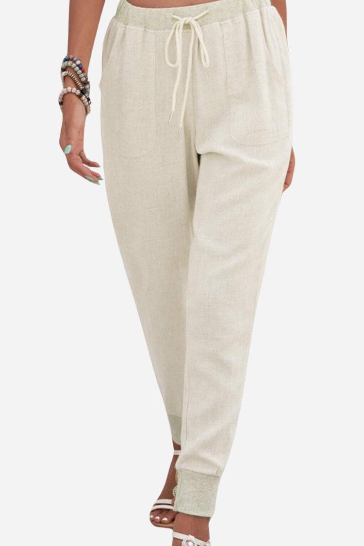 Woman wearing relaxed chic elastic ankles pants in a stylish casual outfit