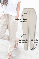 Woman wearing relaxed chic elastic ankles pants styled with casual top and sneakers outdoors