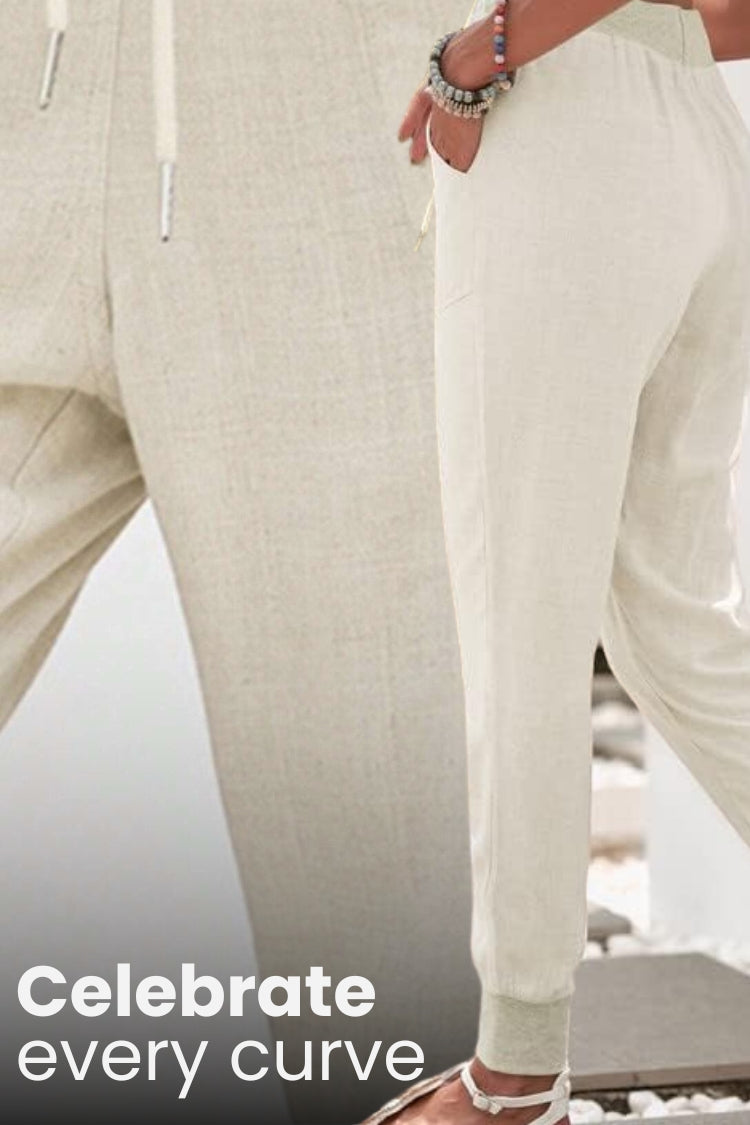 Woman wearing relaxed chic elastic ankles pants in casual stylish pose