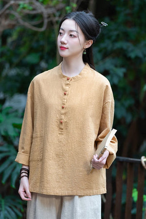Woman wearing one size fits all ramie linen and cotton blouse in beige outdoors