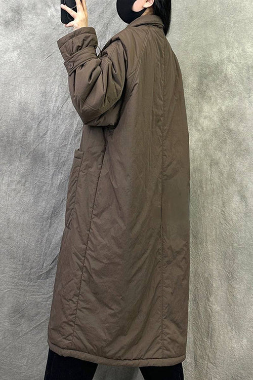 Plus size oversized brown windbreaker parka with long sleeves and relaxed fit worn by model