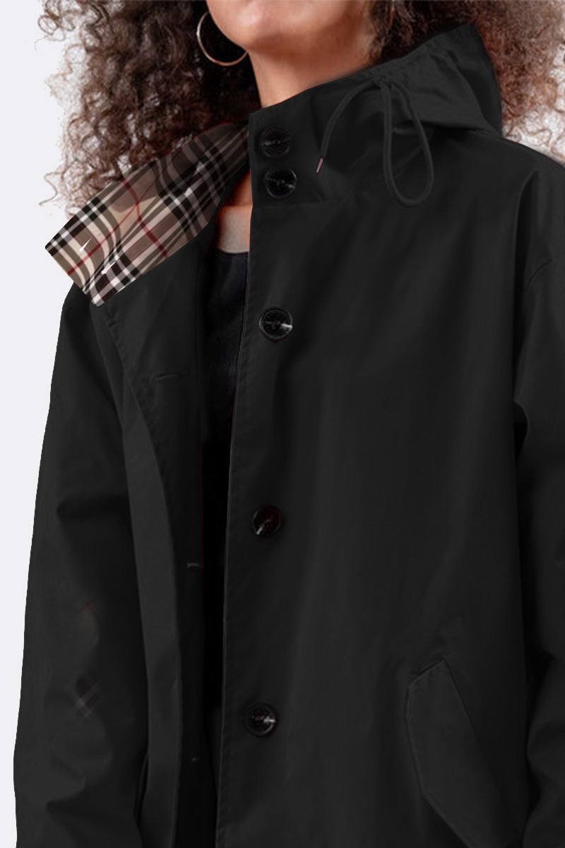 Travel-smart waterproof hooded windbreaker in black with adjustable hood and beige plaid lining.
