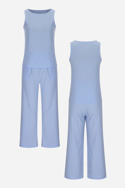 Light blue sleeveless top and wide-leg pants set, sleek silhouette coordinated outfit, lightweight polyester-spandex fabric.