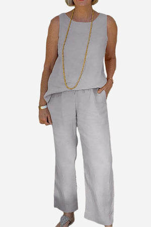 Woman wearing a sleeveless top and wide-leg pants sleek silhouette coordinated set in light gray
