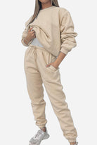 Woman wearing beige Classic Comfort Athleisure set with sweatshirt and joggers