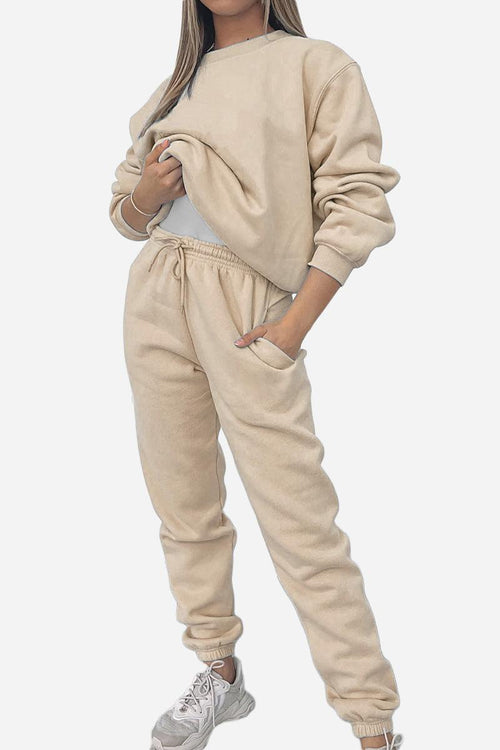 Woman wearing beige Classic Comfort Athleisure set with sweatshirt and joggers
