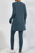 Back view of woman wearing blue Butter Touch Ribbed Two-Piece Set with long ribbed tunic top and matching ribbed leggings against white background