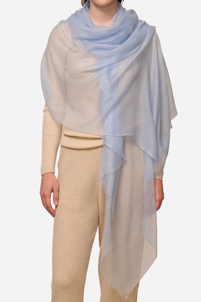 light blue 100% cashmere featherlight luxury scarf draped on model