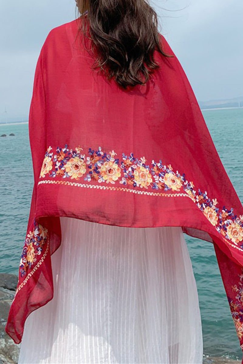 Burgundy Embroidered Travel-Must Shawl with floral design worn over white dress by the sea