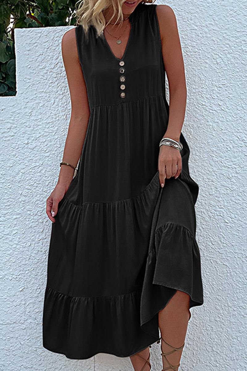 Bohemian tiered midi dress in black with V-neck and button detail, sleeveless summer dress with flowing tiers and empire waist.