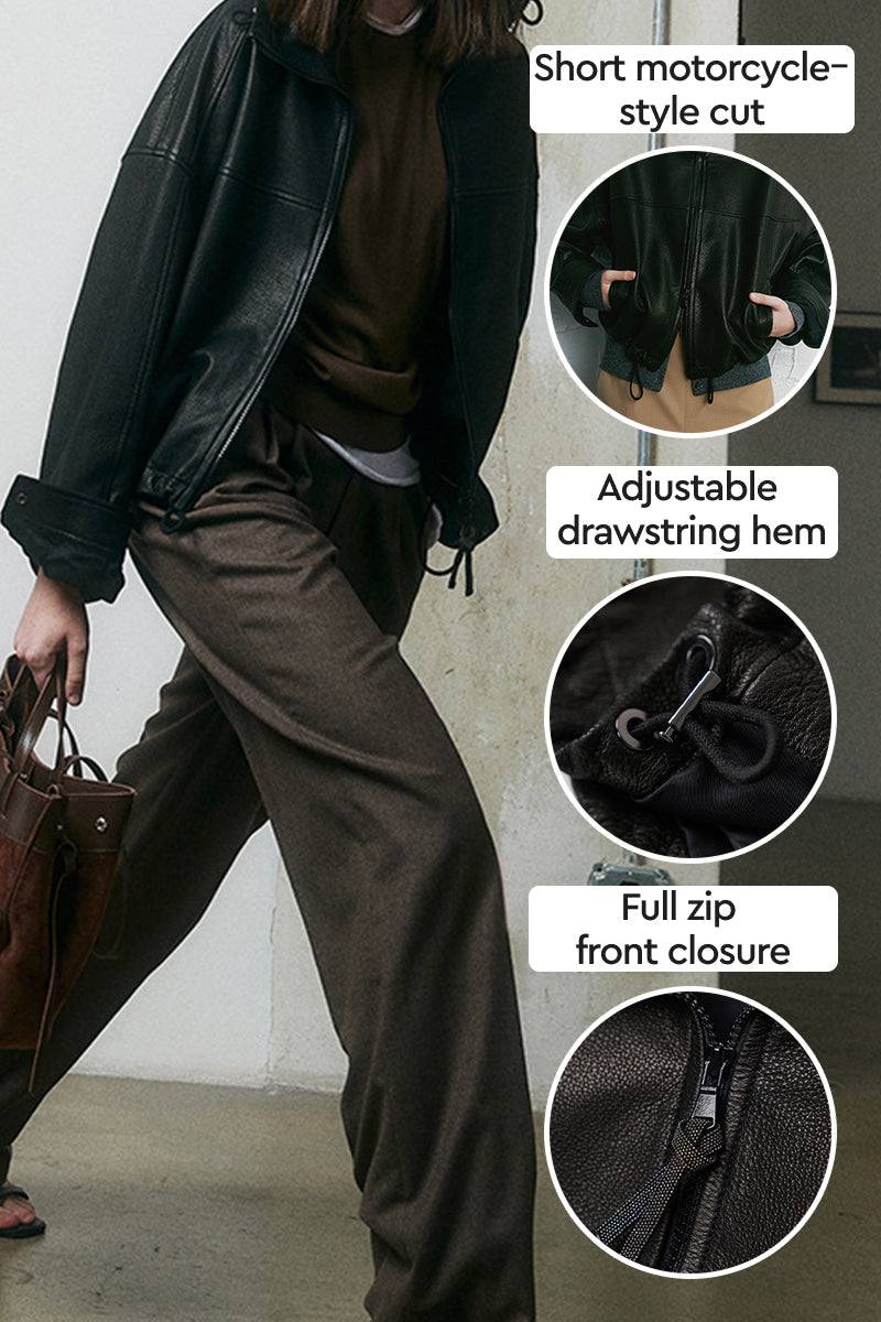 Black sheepskin leather jacket with short motorcycle-style cut, adjustable drawstring hem, and full zip front closure.