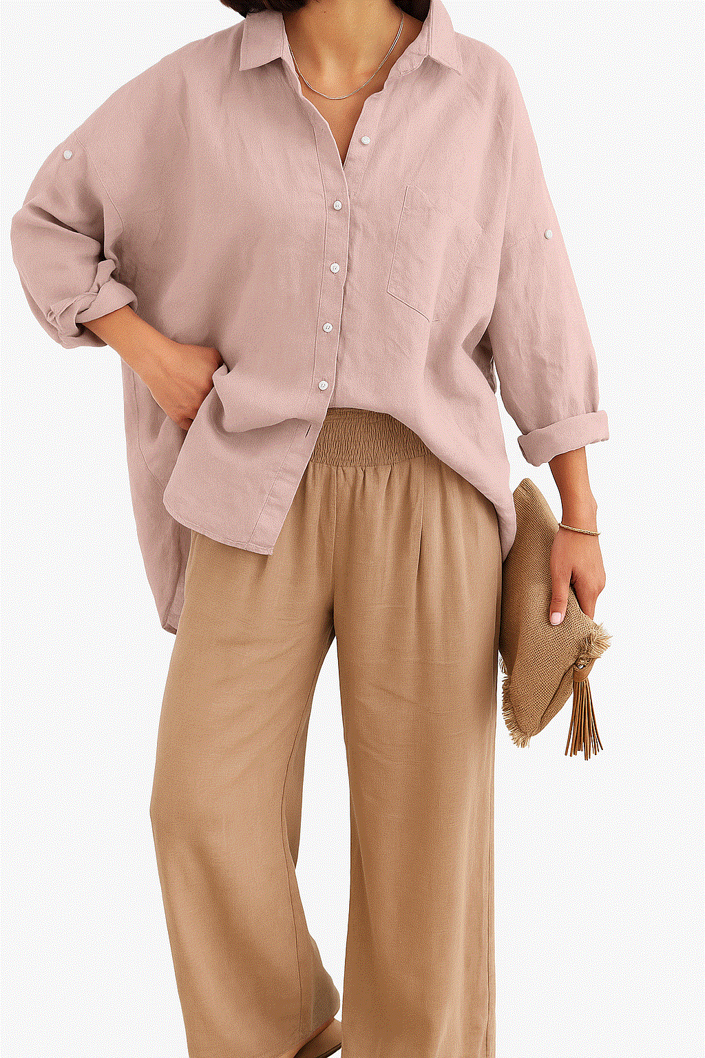 Women wearing Linen Breeze Set with relaxed linen shirt and high-waist cotton blend pants, holding a hat.