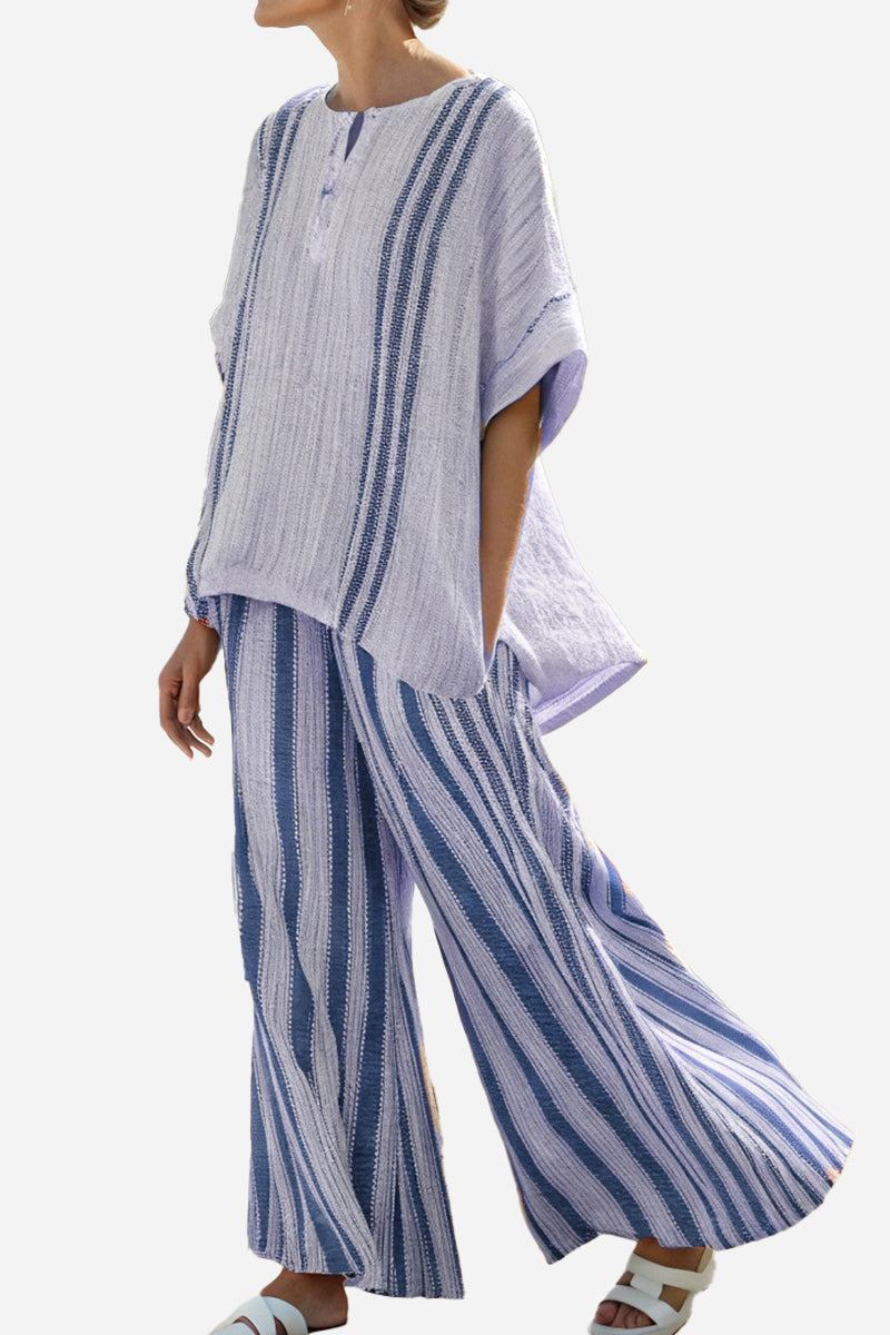 Coastal Comfort Linen two-piece set with blue and white vertical stripes, loose tunic top, and wide-leg pants.
