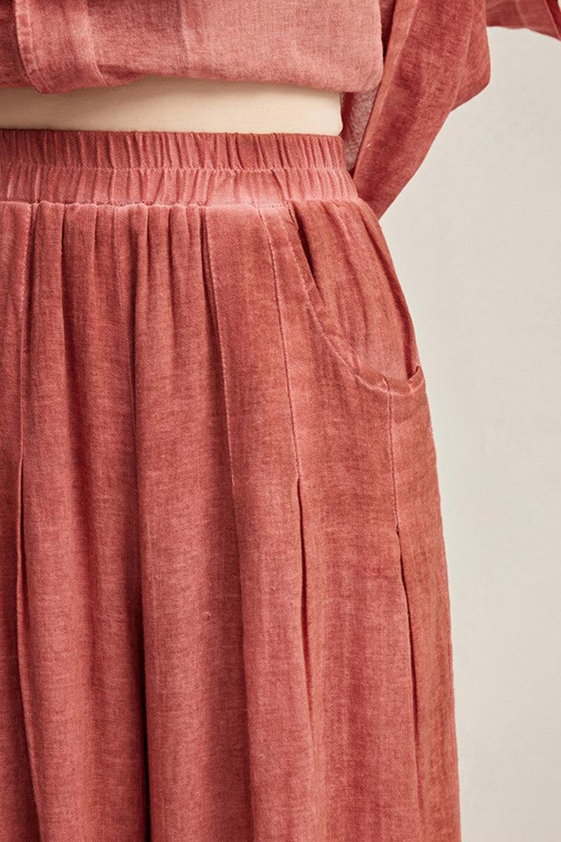 close-up of 100% linen stone-washed wide-leg pants with elastic waist in sunset color