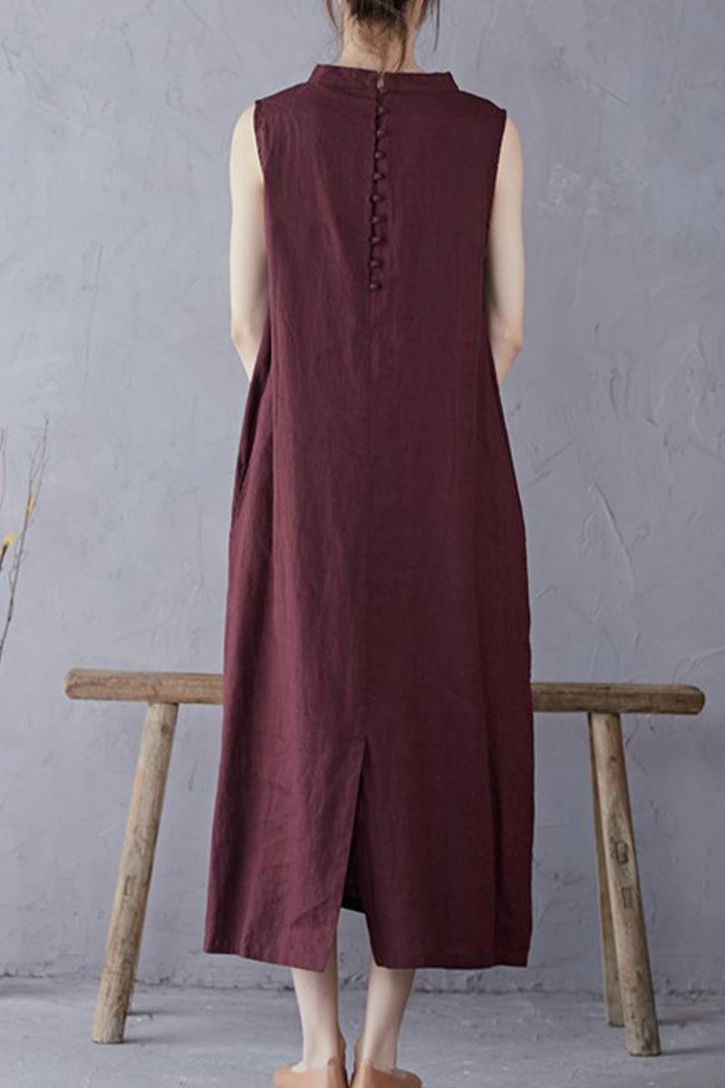 Back view of a sleeveless maroon Sunrise Market 100 linen midi dress with button details on the upper back and a center slit at the hem
