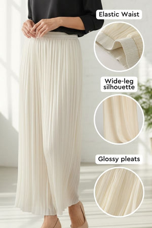 Garden Soirée cotton-silk pleated trousers with elastic waist, wide-leg silhouette, and glossy pleats in light beige.