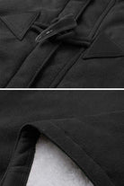 Close-up of warm toggle button and soft faux suede fabric on a hooded coat with sherpa lining