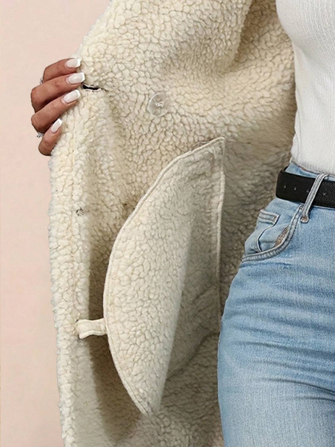 Woman wearing mid-thigh faux suede sherpa coat with contrast collar and side pockets