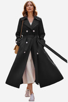 Woman wearing timeless retro belted trench coat with double-breasted design and wide lapels, styled for everyday elegance.