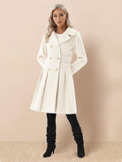 Tailored fit and flare trench coat with double-breasted buttons and pleated A-line hem, made of smooth, non-wool fabric.
