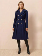 Tailored fit and flare trench coat with double-breasted buttons and pleated hem