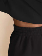 close-up of black Warm & Easy Two-Piece Set showing elastic waistband and soft fabric texture