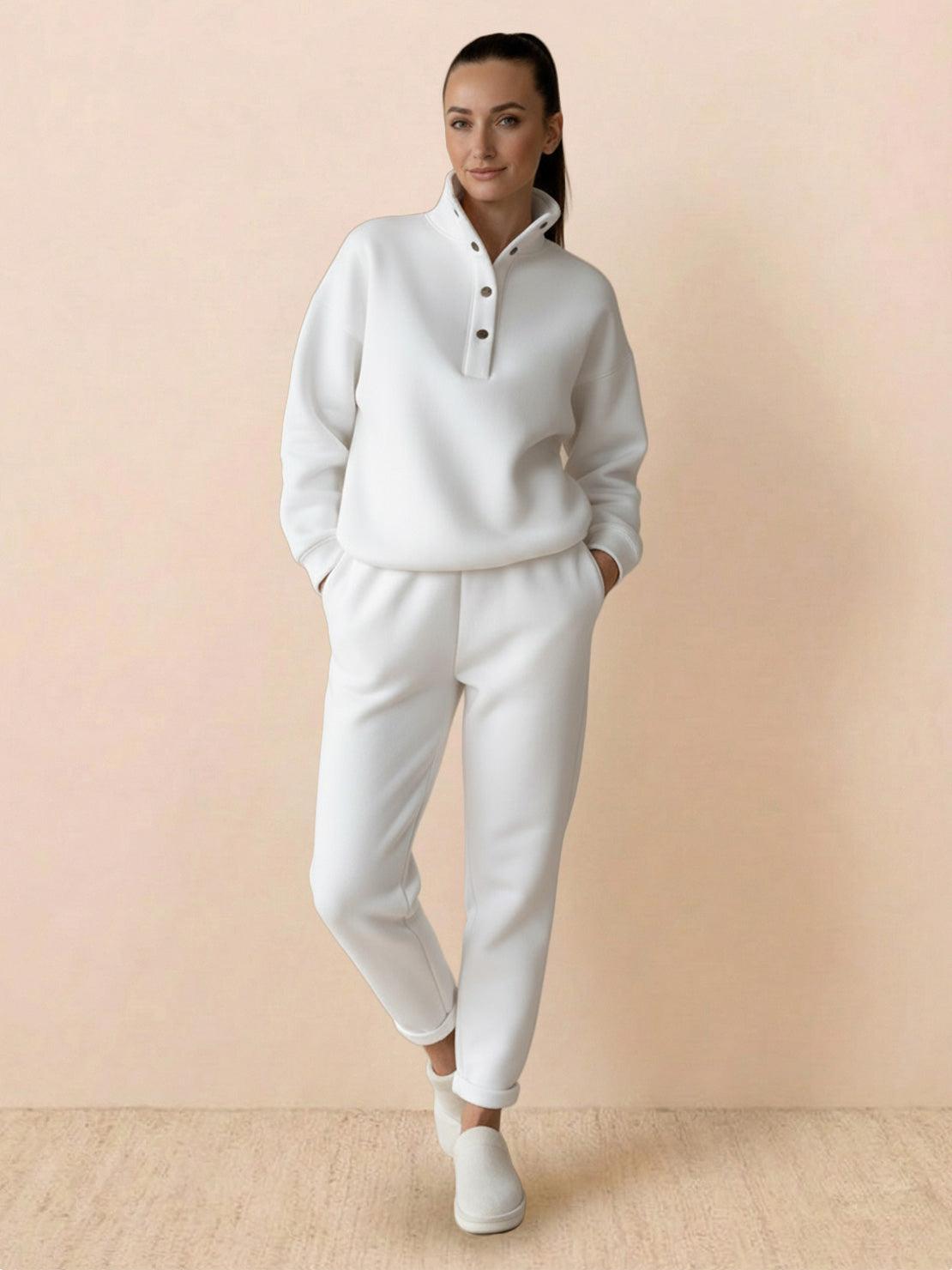 Woman wearing warm and easy two-piece set in white with pullover hoodie and matching pants