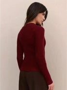 Women’s ribbed zip-up knit cardigan with high neckline and fitted cuffs
