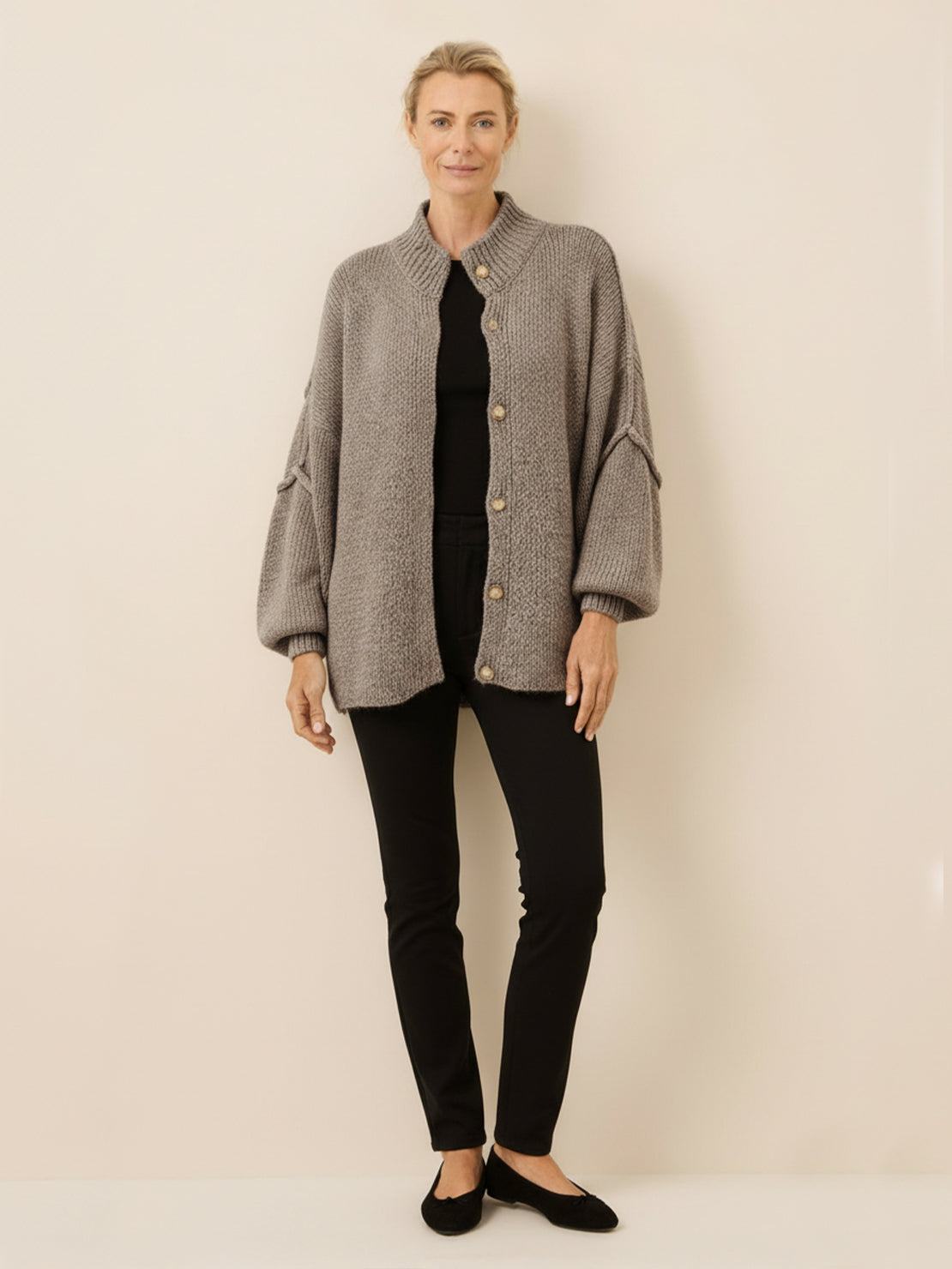 Oversized button-front knit cardigan with balloon sleeves and gold-tone buttons in chunky knit texture